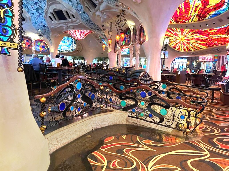Beautiful. ornate forged steel with glass and gold leaf railing surrounds the "Gaudi Bar at Sunset Station Casino in Las Vegas, Nevada.
